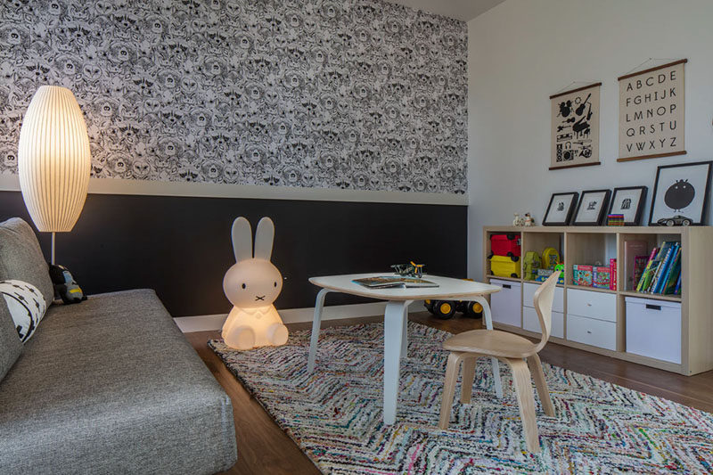 This room has been set up as a children's play room with fun black and white wallpaper. #Playroom #KidsRoom