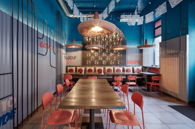 This modern Mexican restaurant features cacti motifs throughout, like mini cacti on the wall that are backlit and the wire-frame cacti artwork on the wall. #RestaurantDesign #InteriorDesign #Cacti