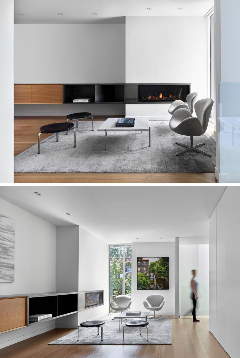 Stepping inside this modern house, there's a sitting area with a built-in fireplace, and views of the street. #SittingRoom #Fireplace