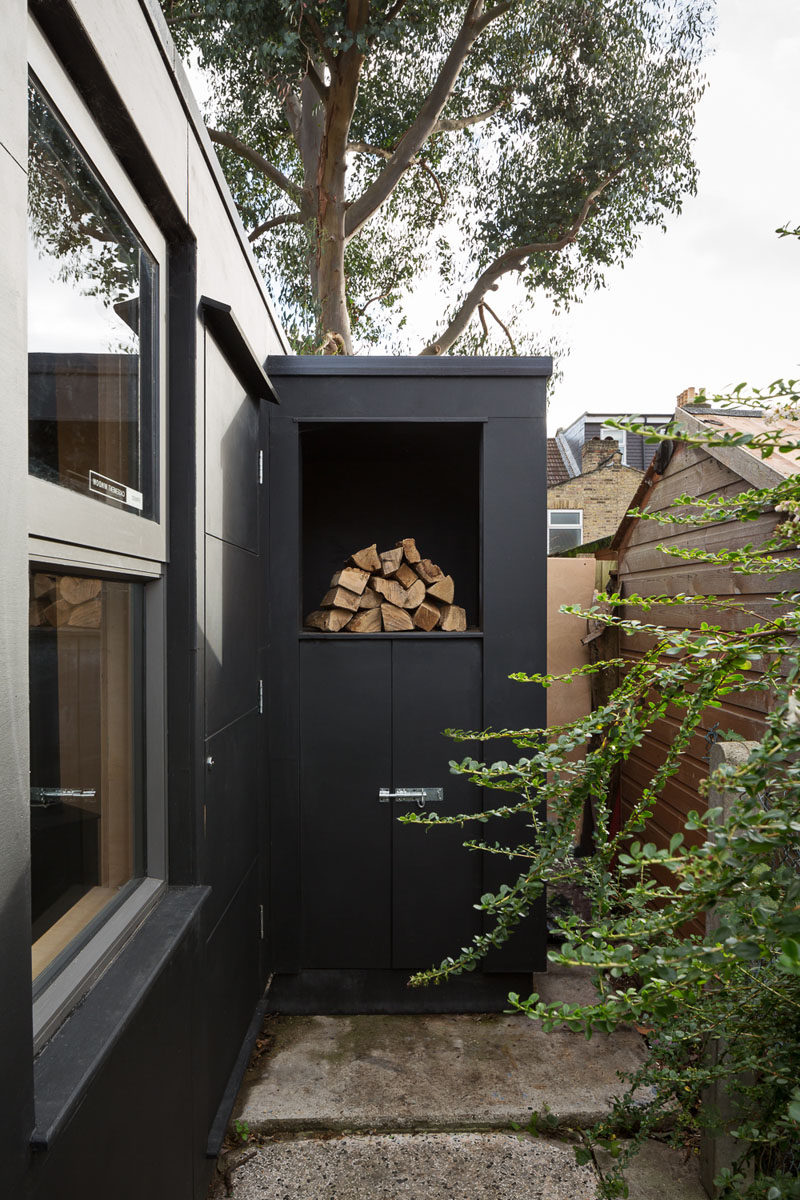 This backyard pottery studio has a built-in space outside for firewood storage. #FirewoodStorage