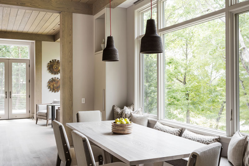 This narrow dining table has a dining table with a built-in window seat. #DiningTable #DiningRoom