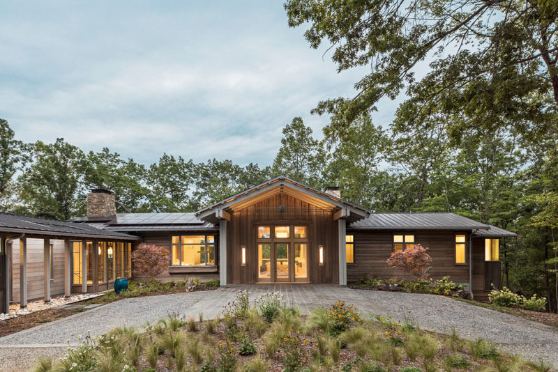 Samsel Architects have designed a modern farmhouse in Mill Spring, North Carolina, as a relaxing refuge for its owners. #ModernFarmhouse #Architecture