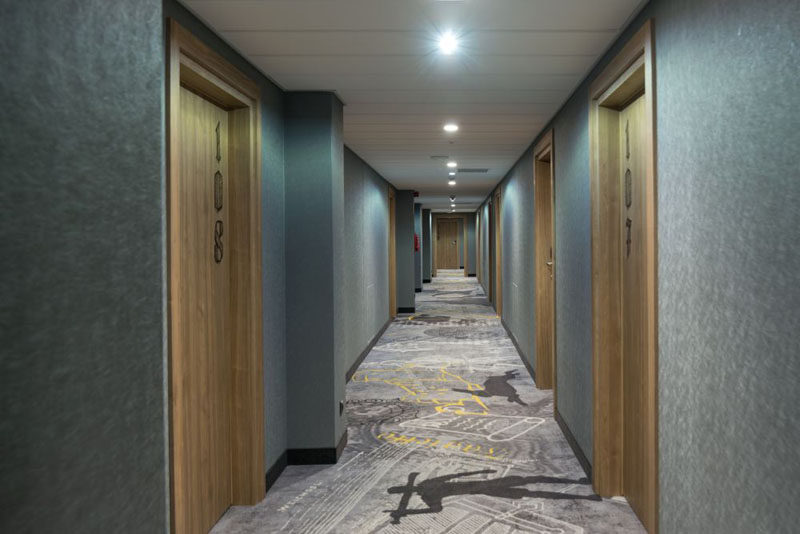 In this contemporary and fun hotel, carpet with knights, scrolls and other motifs lead you to the rooms. #HotelDesign