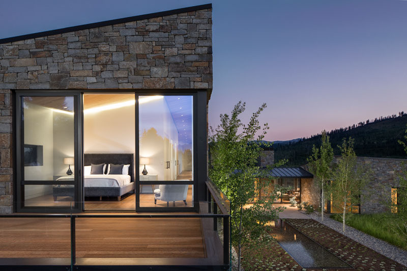 This modern master bedroom is located at the end of the hallway and it features hidden lighting, and opens up to a private balcony. #MasterBedroom