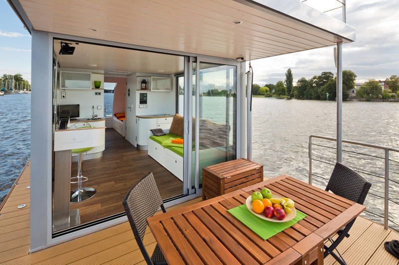 This modern houseboat has two outdoor spaces, one deck at the back of the boat and a roof top deck. #ModernHouseboat #Houseboat