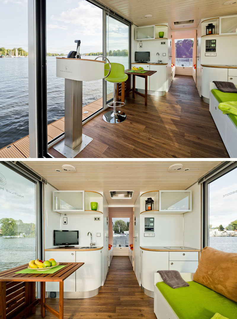 This modern houseboat has a small fitted kitchen with upper and lower cupboards, a sink unit with tap,  a fridge and a two plate hob. #ModernHouseboat #SmallKitchen