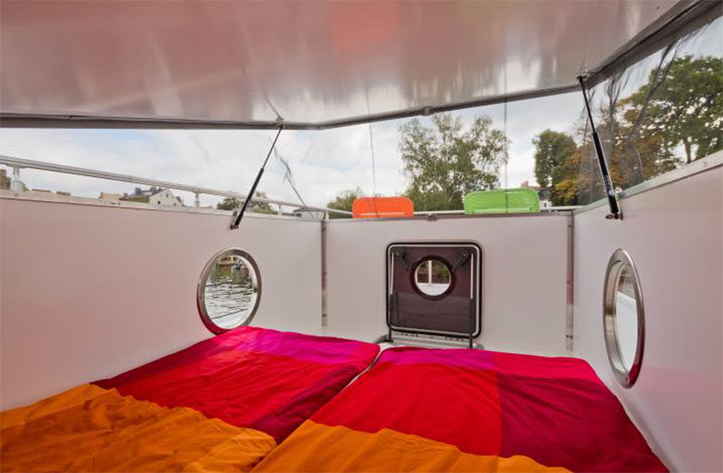 This modern houseboat has a rooftop cabin that sleeps two. #ModernHouseboat