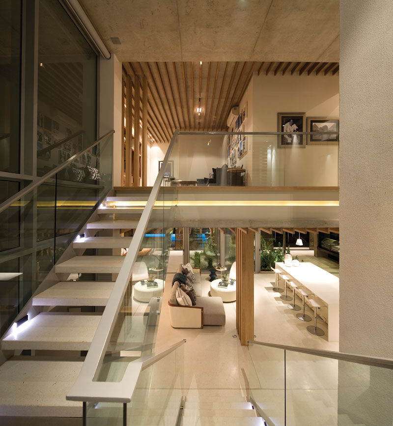 These concrete stairs that match the floor throughout the interior lead to the second floor of the home. #ConcreteStairs #Staircase