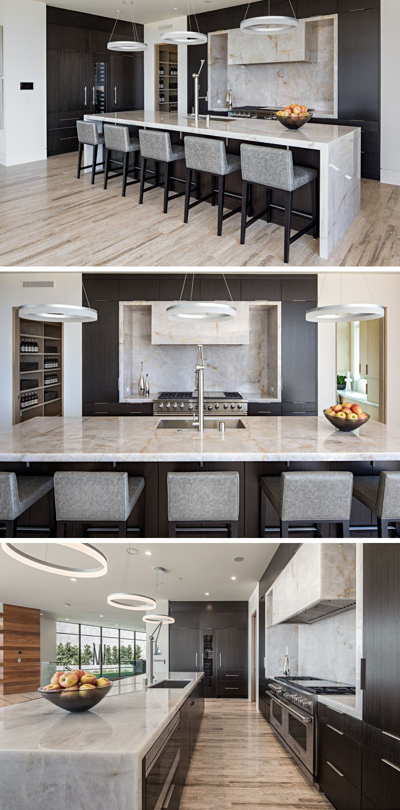 This modern kitchen has dark wood cabinets with a light colored stone countertop that's featured on the island and surrounding the stove top.