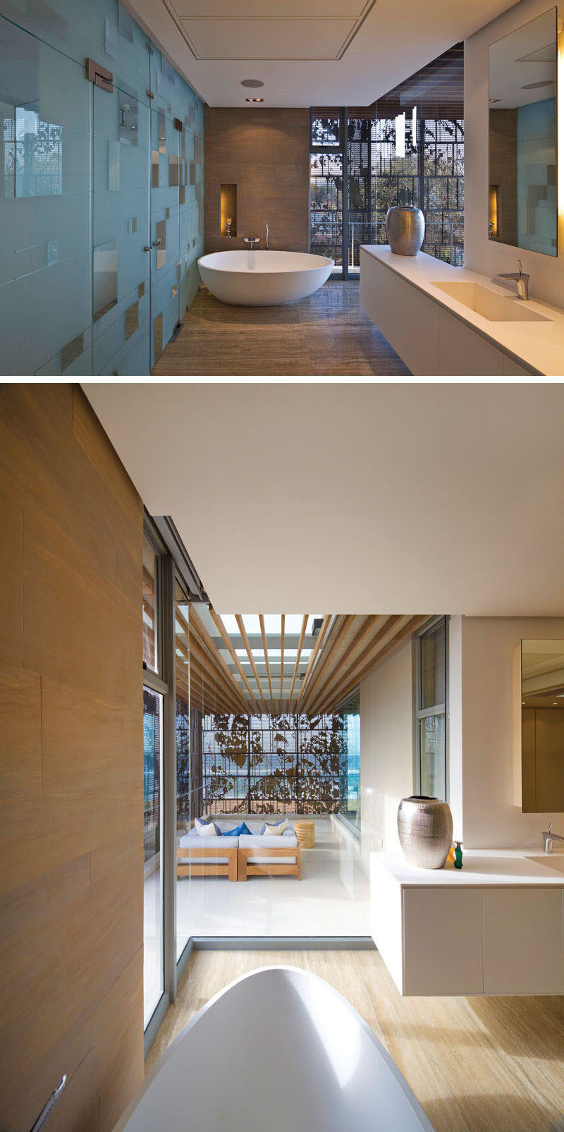 In this modern master bathroom, there's a long vanity and a white freestanding bathtub that looks out onto the balcony through floor-to-ceiling windows. #MasterBathroom