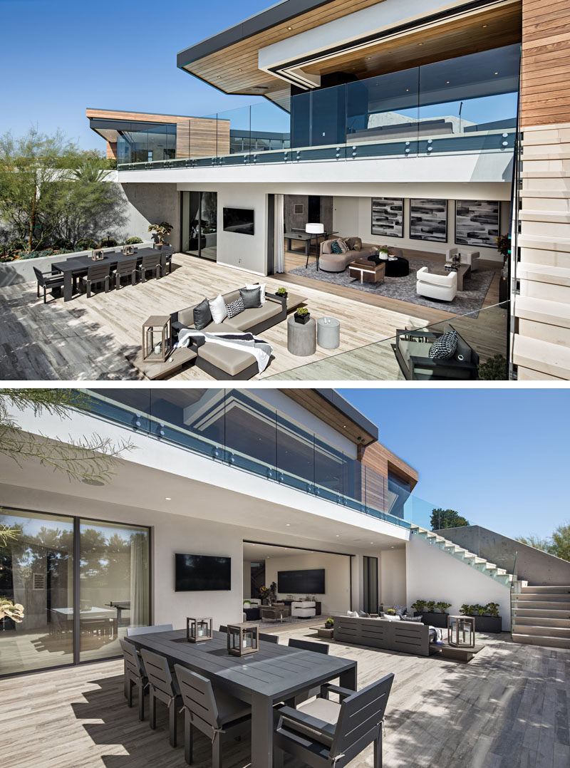 This modern house has an outdoor lounge and dining area that's located off the basement living room, making it an ideal place for entertaining friends. #OutdoorEntertaining #OutdoorSpace