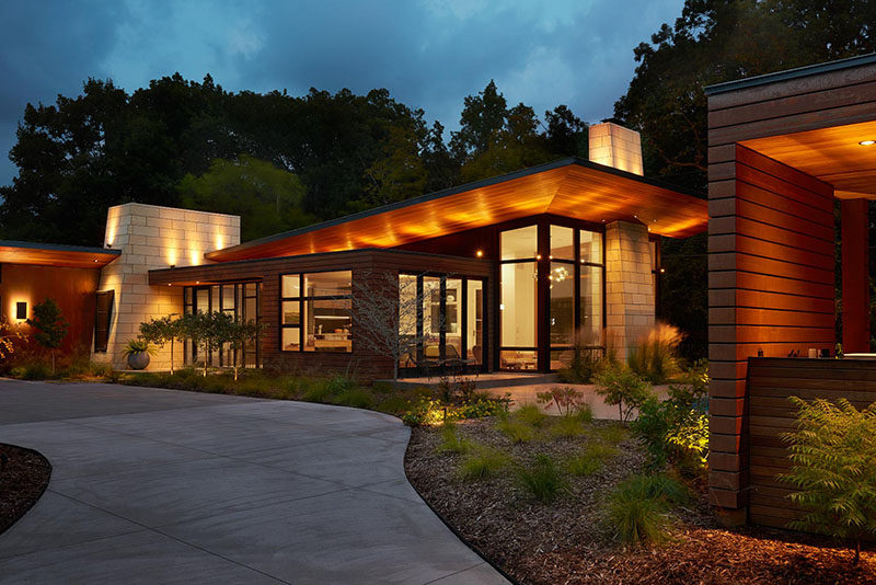 This modern ranch house uses a variety of key materials throughout its design, like Corten Steel wall panels, natural Cedar, ground and polished concrete and Kasota limestone. #ModernRanchHouse #ModernArchitecture #HouseDesign