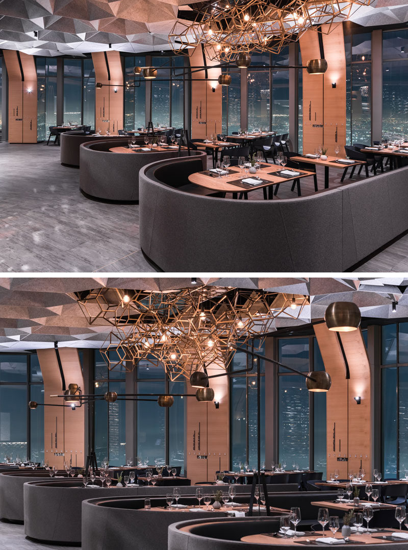 This modern restaurant has hexagonally shaped cellular coffers made of recycled plastic that help to dampen sound. #ModernRestaurant #InteriorDesign #RestaurantDesign