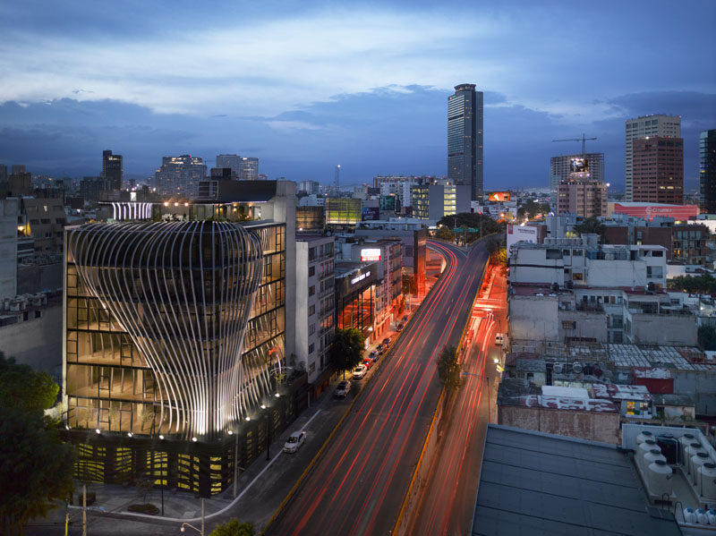 Belzberg Architects have designed a modern office building that features 272 metal fins that create a sculptural facade and travel through to the interior of the building. #Facade #Architecture