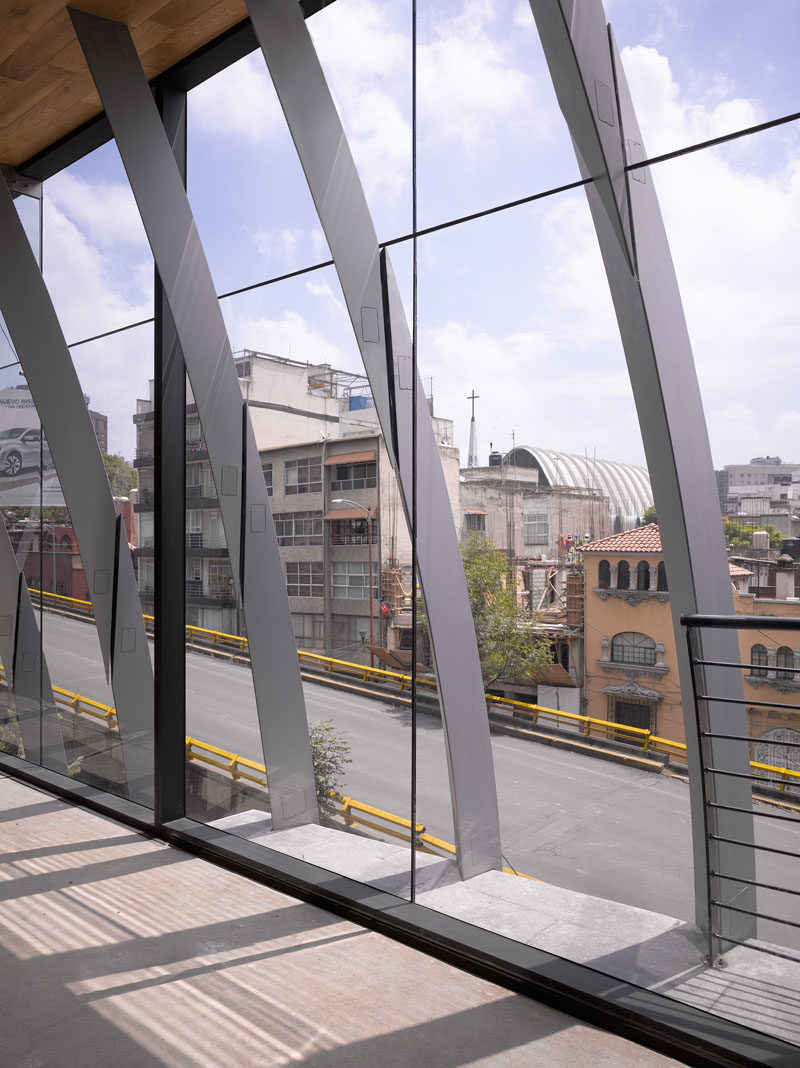 Belzberg Architects have designed a modern office building that features 272 metal fins that create a sculptural facade and travel through to the interior of the building. #Facade #Architecture