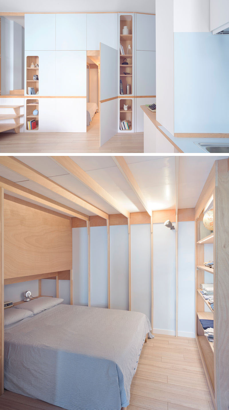 This small studio apartment has a custom designed plywood wall unit that has two sleeping areas and plenty of storage. #SmallApartment #InteriorDesign