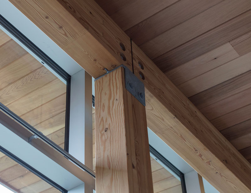 Here's a closer look at the wood posts and beams that have been used through the structure of a modern house. #Architecture