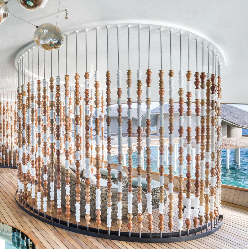 This modern spa in the Maldives uses abacus-like partition walls to create a sense of privacy but at the same time, allowing the breeze to travel through the space. #ModernSpa #PartitionWall #RoomDivider