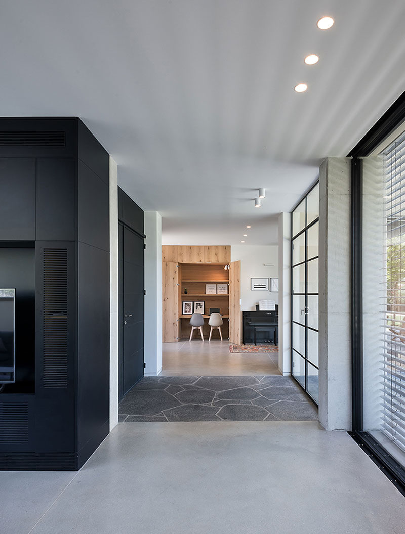 This modern house has a small desk area that's tucked away into a closet. #HiddenDesk