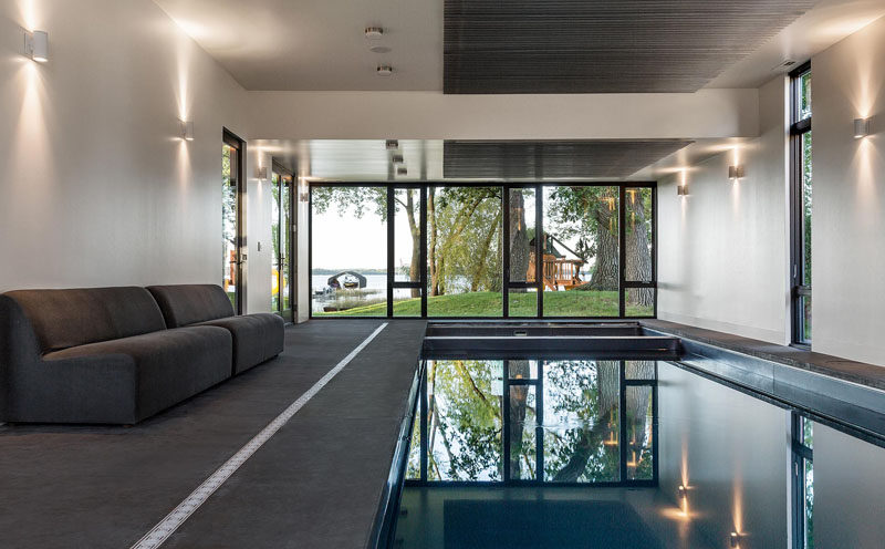 This industrial modern house has an indoor swimming pool with direct access to the lakeside of the property. #IndoorPool #SwimmingPool