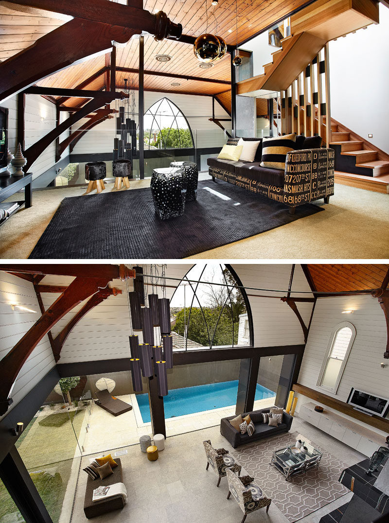 This modern church conversion has a mezzanine level that's home to a rumpus room and that overlooks the living room void and and has valley views through the large arched window. #ChurchConversion #Mezzanine