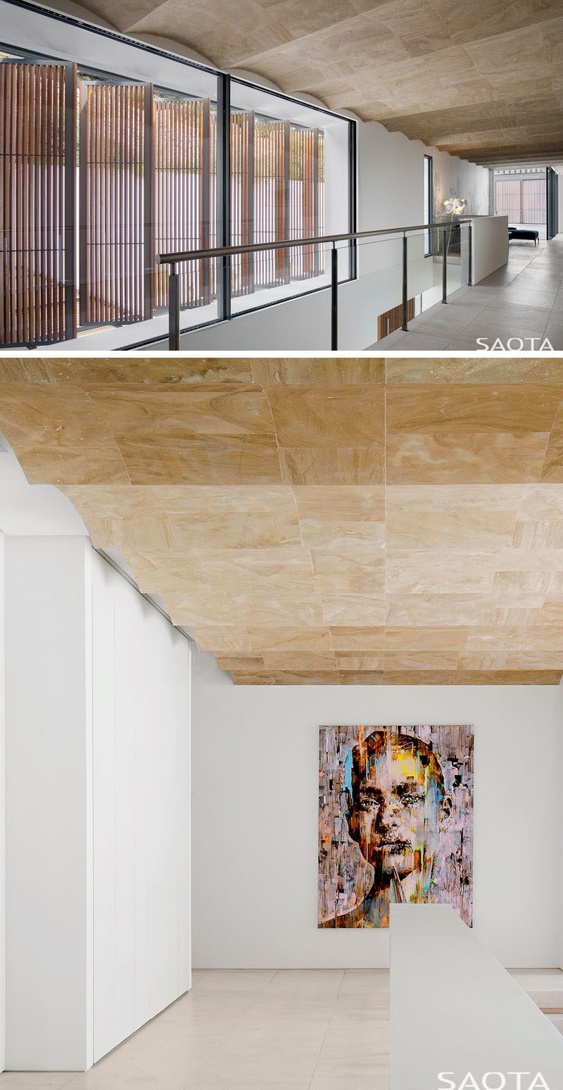 Inside this modern house, there's a gallery-like space with signature barrel vaulted ceilings. #VaultedCeiling #InteriorDesign