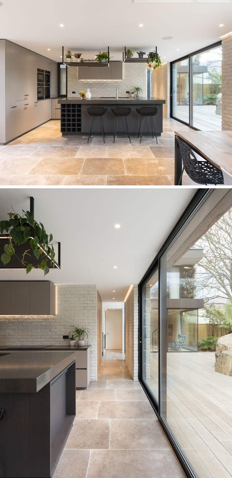 In this kitchen, a dark grey island and light grey cabinetry has been used to create a modern appearance. #KitchenDesign #ModernKitchen