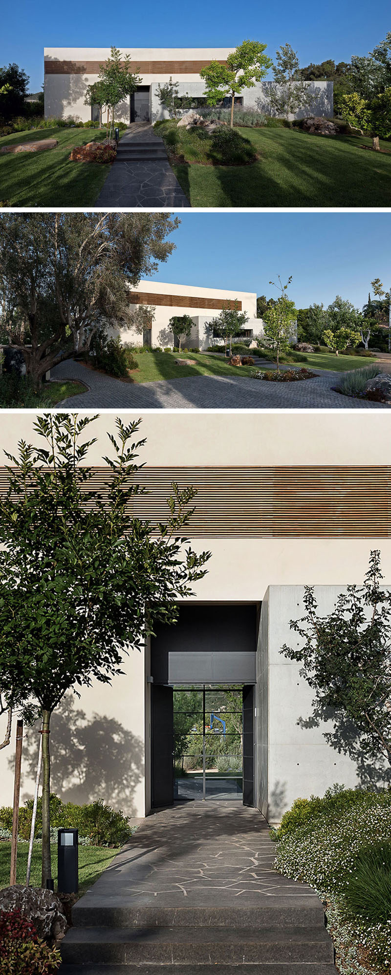 At the front of this modern house, a stone path leads through the garden to the front door. #Landscaping #GardenPath #FrontDoor