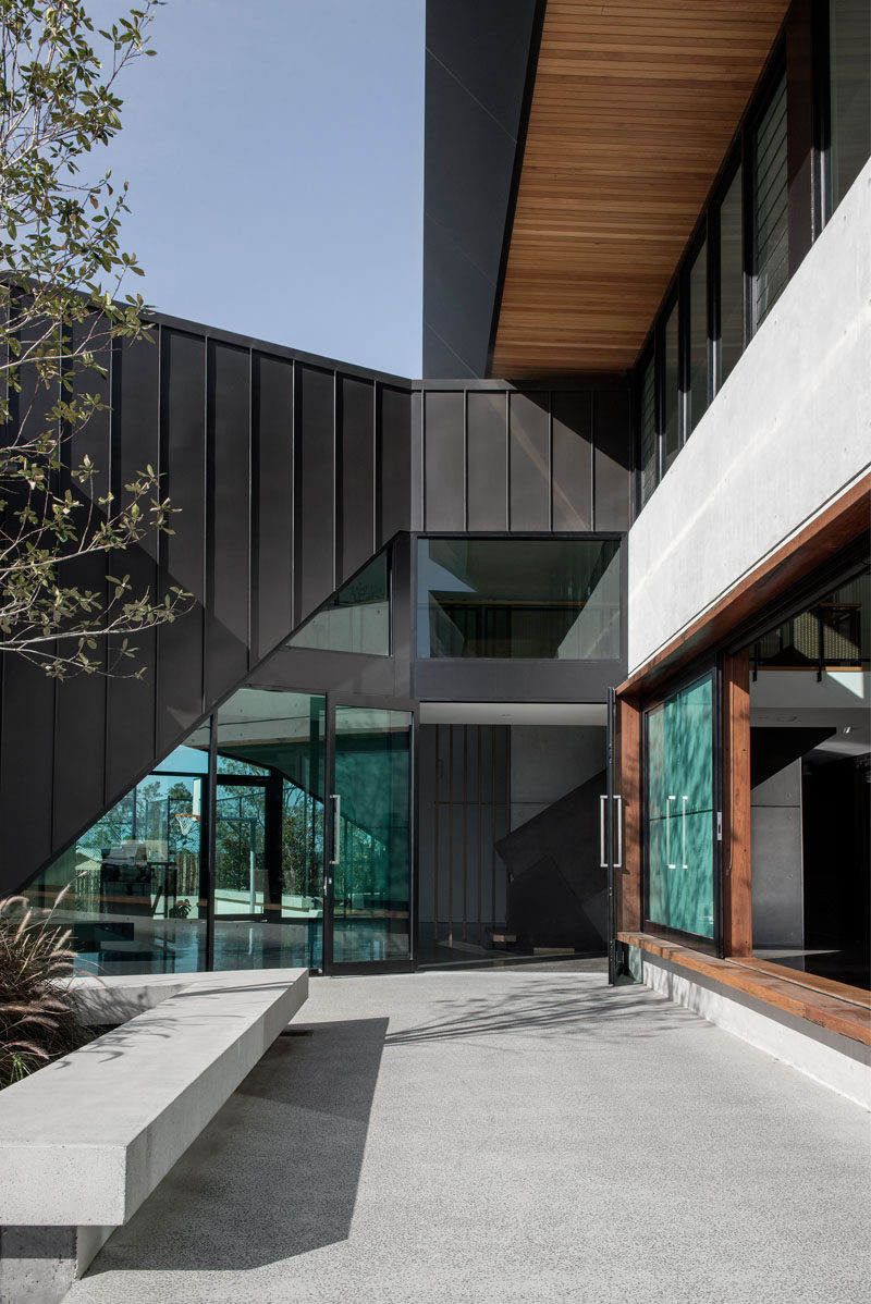 A dark zinc form has been used to connect a renovated church on the left and the new house on the right. #Architecture #ModernHouse