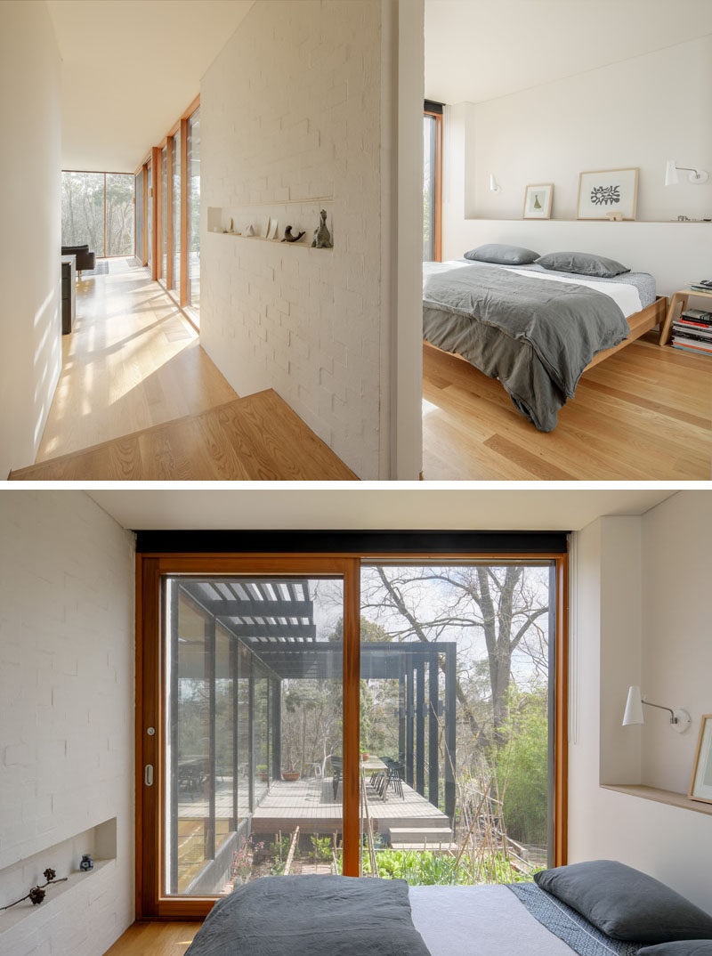 This simple modern bedroom has built-in shelving and a sliding door that opens up to a vegetable garden. #Bedroom #SlidingDoor