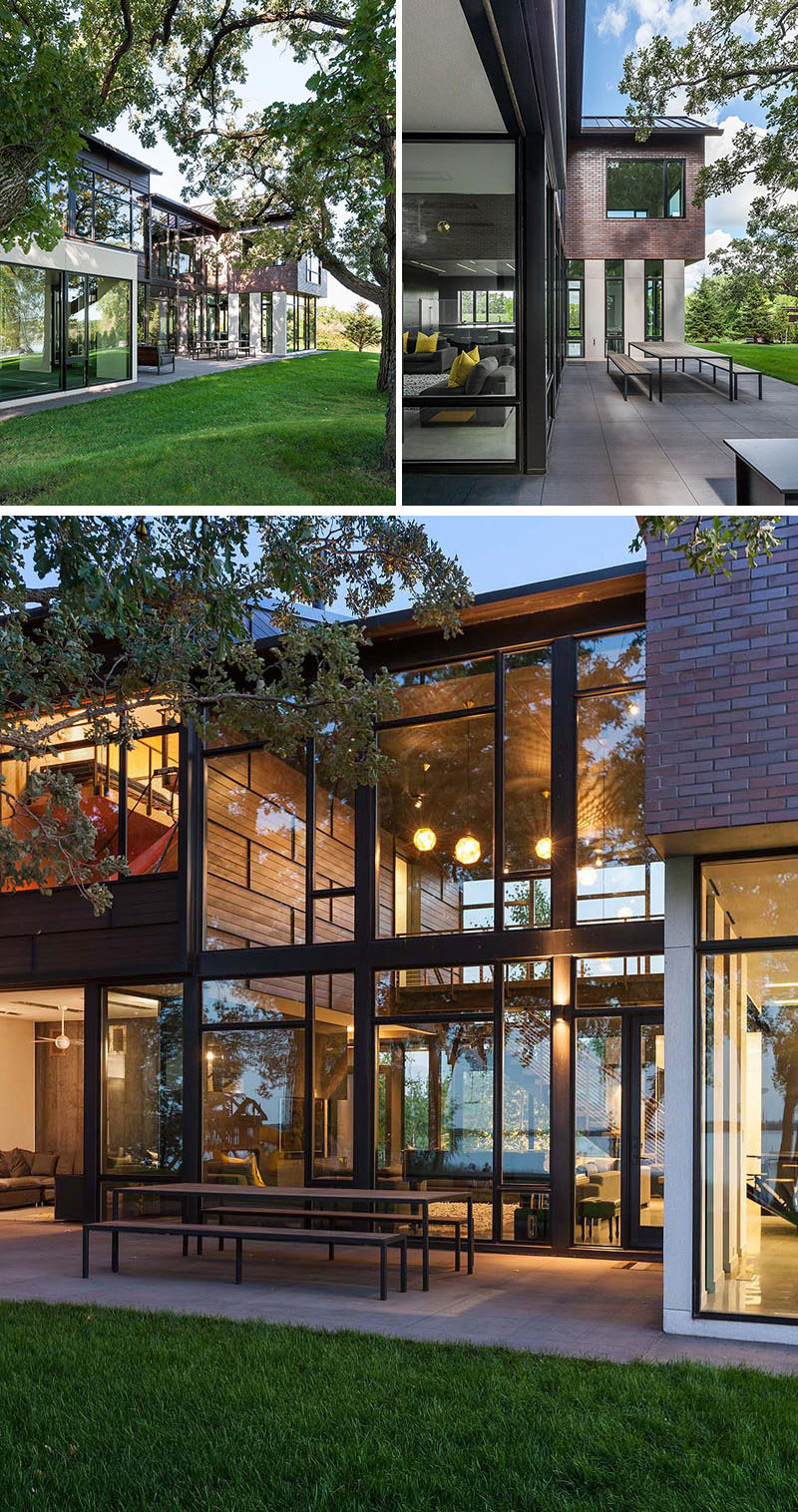 This industrial modern house has been designed to promote the outdoors and active lifestyle of the family, and the interior of the house opens up to an outdoor dining space and lounge area. #IndustrialModern #OutdoorDining #Windows