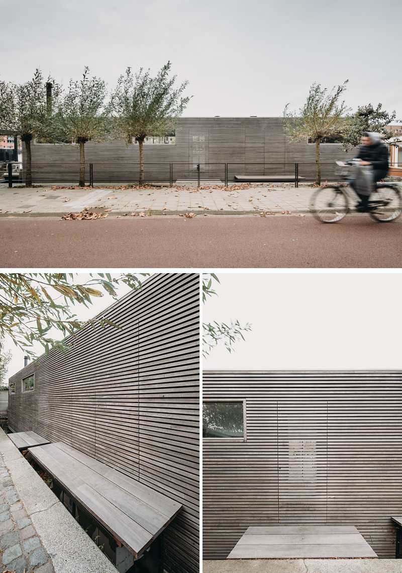 This floating villa (or houseboat) is clad in wood which creates a strong textured facade that's bordered with a slim aluminum roof trim. #ModernFloathome #ModernHouseboat