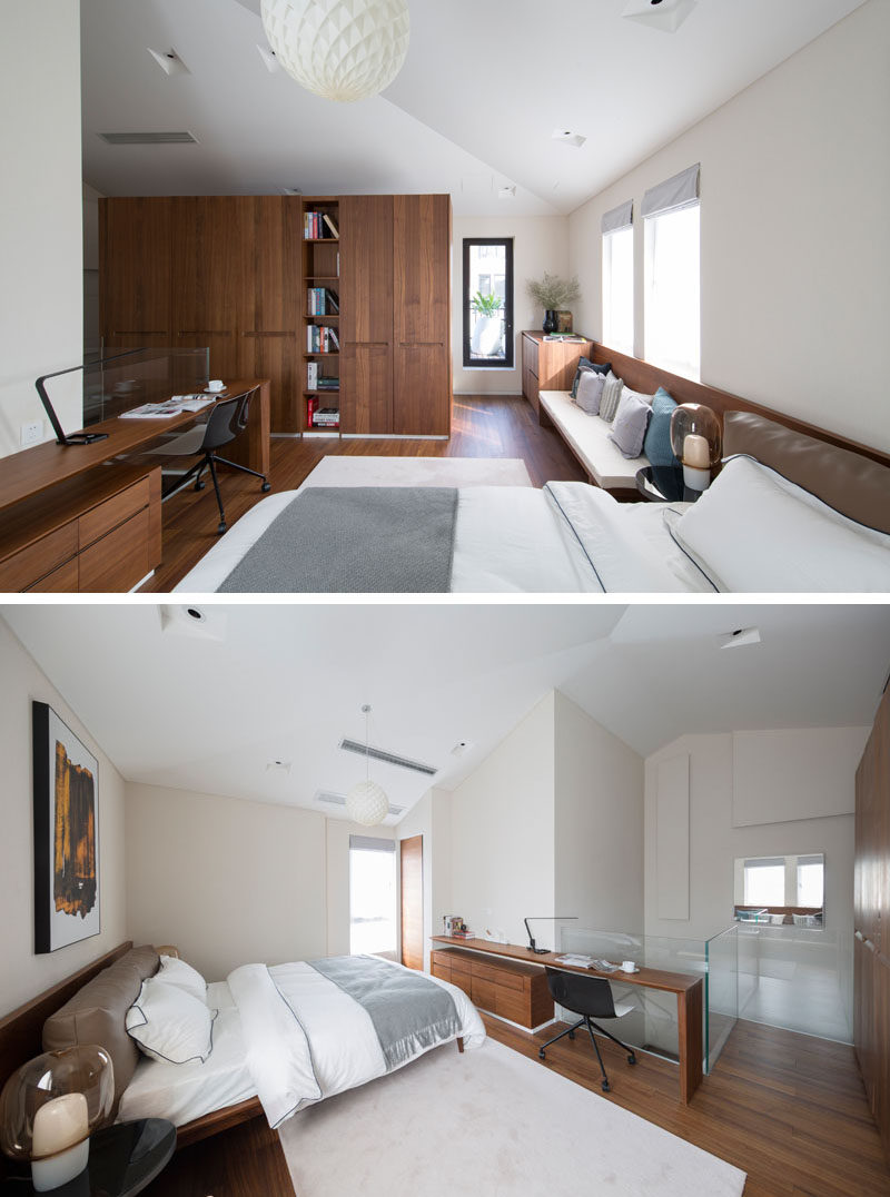 In this modern bedroom there's a work area with a minimalist desk that attaches to the wall, and underneath is a floating set of drawers that are mounted to the wall. #ModernBedroom #HomeOffice