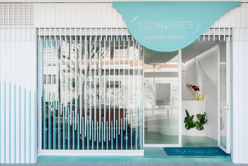 Masquespacio have designed Somriures, a new modern dental clinic in a small town in Spain, that features a sculpture made from 2884 wood strips. #DentalClinic #InteriorDesign