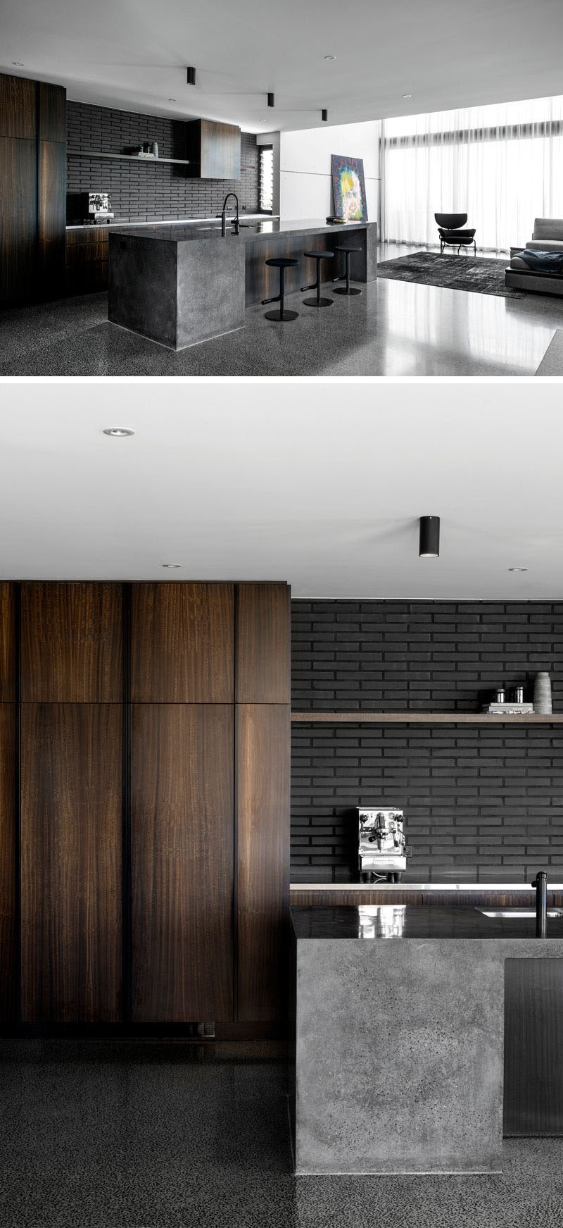 Dark brick has been paired with dark wood cabinets and a concrete island in this modern kitchen. #ModernKitchen #DarkBrick #Concrete