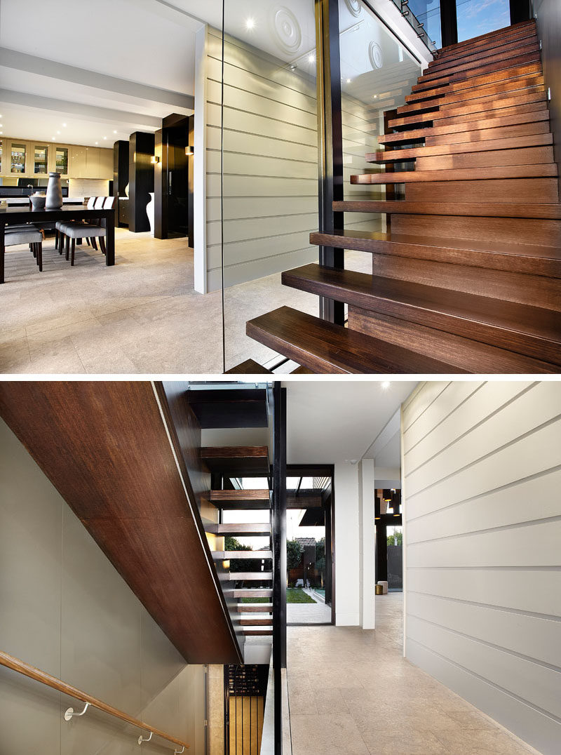 Wood stairs connect all of the levels of this converted church and lead up to the mezzanine. #ConvertedChurch #Stairs