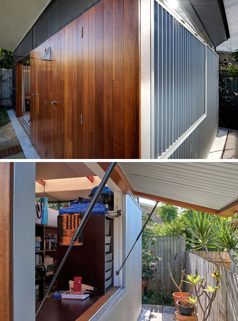 The exterior of this modern backyard studio that faces the garden is clad in a warm hardwood timber (blackbutt ) panelling, while Zincalume corrugated iron wraps around the remaining three sides of the structure, protecting it from the elements. #BackyardStudio #WoodFacade #CorrugatedSiding