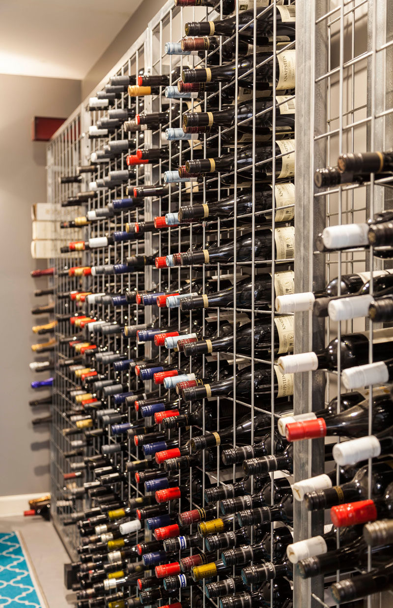 This wine cellar has a metal cage-like shelving unit to store the wines. #WineCellar #WineStorage