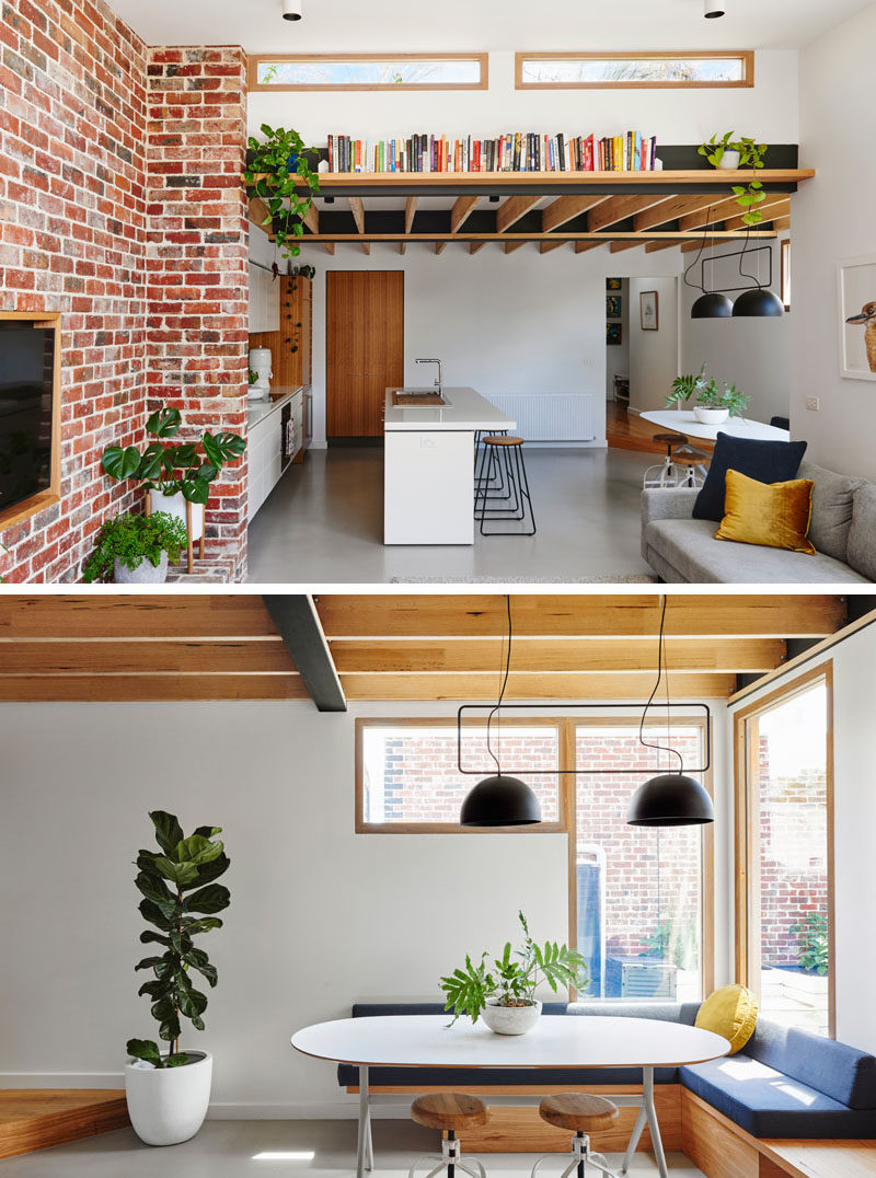 The dining area in this open plan room, is tucked into the corner and has banquette seating to make use of the space. #DiningArea #CornerDiningTable #BanquetteSeating