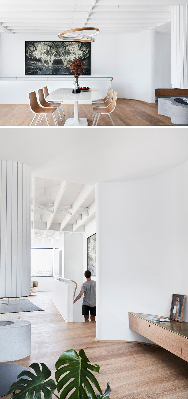 This modern dining area in an open plan living/dining/kitchen area, is anchored in the space by the use of an ‘Oracle’ pendant by Christopher Boots. #ModernDiningRoom #Stairs