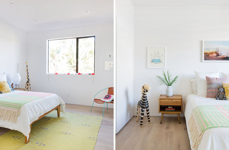 In this contemporary child's bedroom, a few colors have been added in the form of a rug, artwork and pillows on the bed. #Bedroom #ContemporaryBedroom