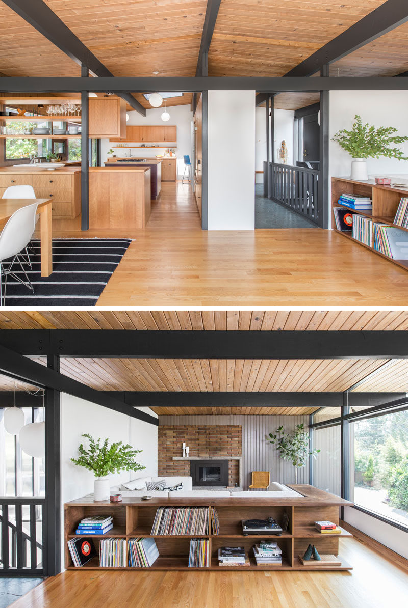 In this updated mid-century modern living room, a shelving unit wraps around the back of the couch, providing a separation in the open plan living/dining room, and at the same time, creating a display space for a record collection. #Shelving #LivingRoom #Couch