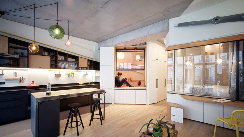 This modern apartment in Paris has glass walls to keep the bedrooms bright. #ModernApartment #GlassWall #Windows