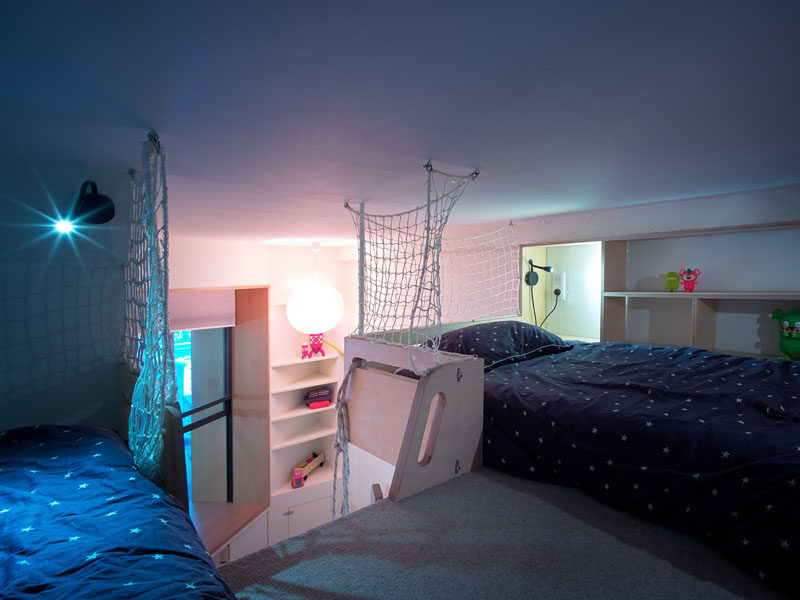 This lofted bedroom has enough room for two beds, and a simple net feature protects the children from falling to the space below. #LoftedBedroom #KidsBedroom