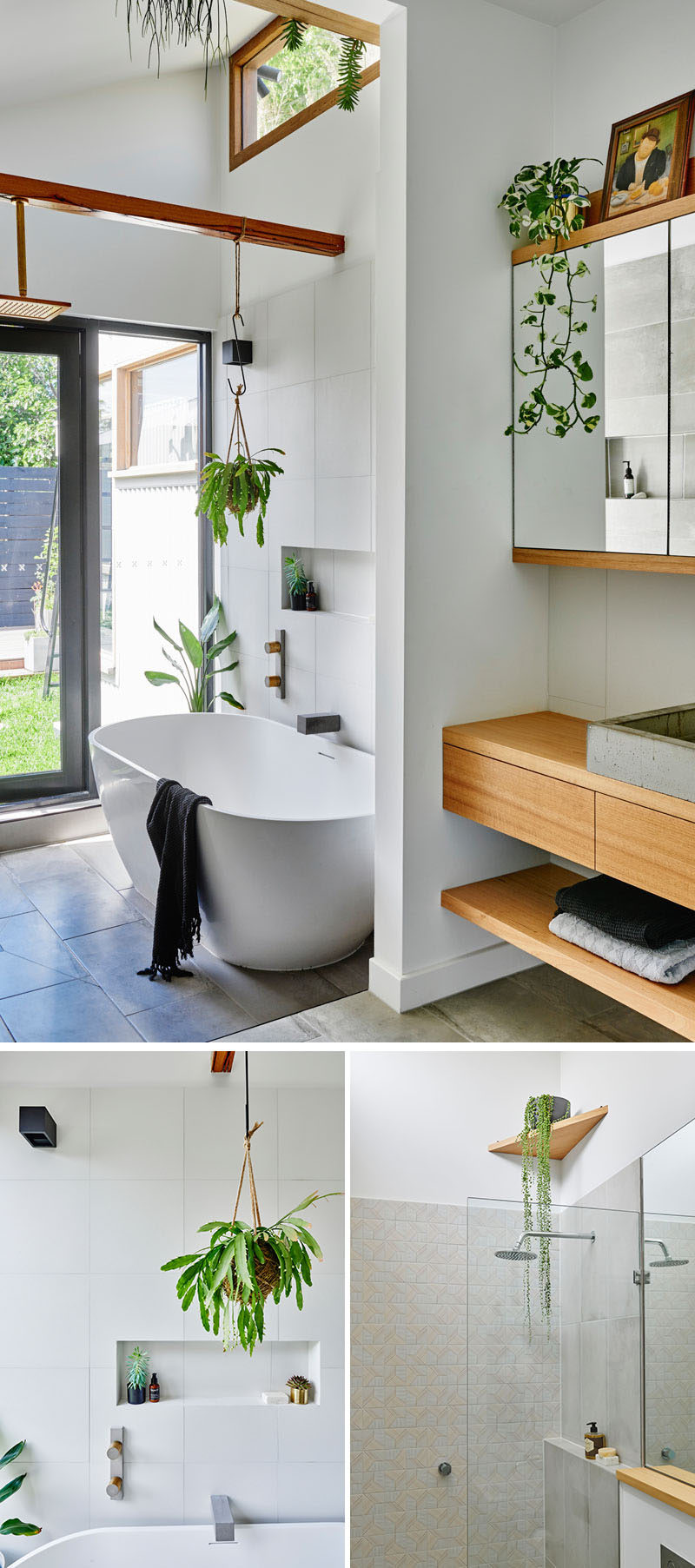 In this modern updated bathroom there's a freestanding bathtub with views of the backyard, while wood elements and plants add a natural touch to the space. #ModernBathroom #WhiteAndWood