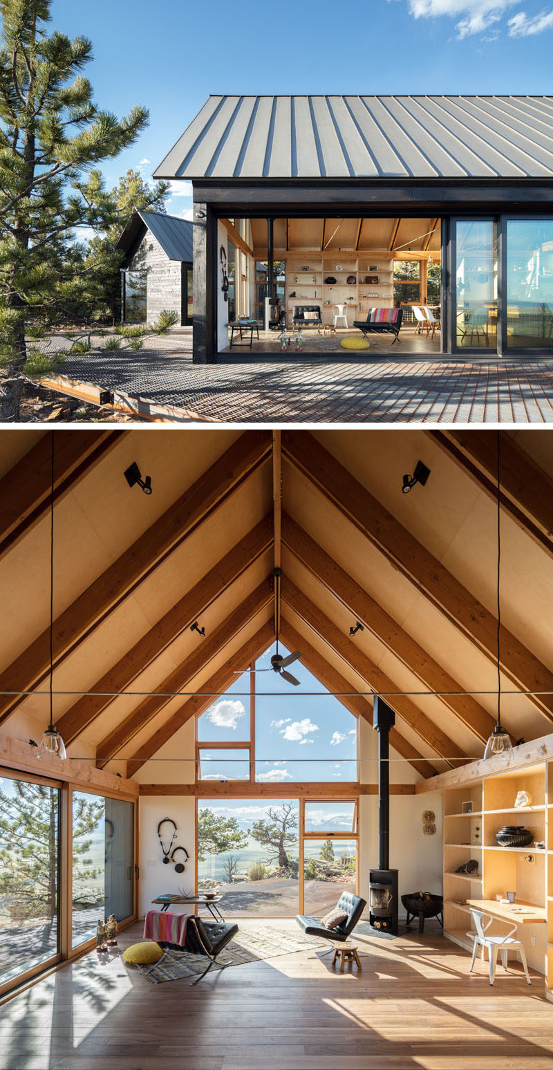 Exterior cedar siding has been stained dark to blend this modern cabin with its surrounding forest, and large expanses of glass connect the occupants to the landscape beyond. #ModernCabin #CedarSiding #CabinInterior