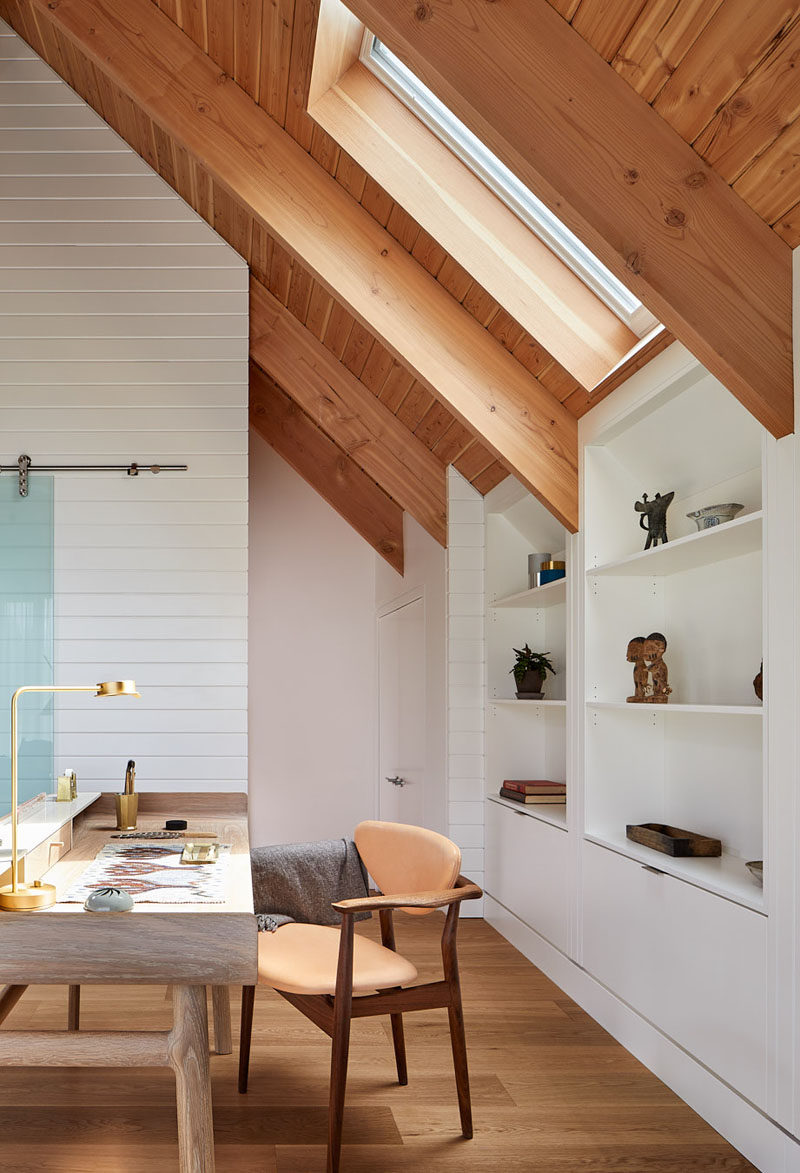 This loft space above a garage has been set up as an artist’s studio and a self-contained guest suite. #Loft #ArtStudio #GuestSuite