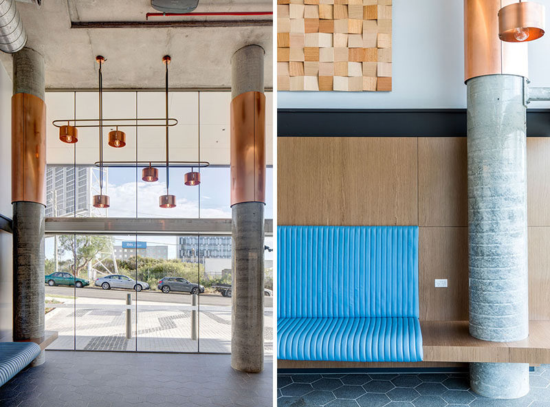 This modern hotel has double height ceilings in the lobby, with pops of copper and raw concrete elements. #ModernHotel #HighCeilings #Copper