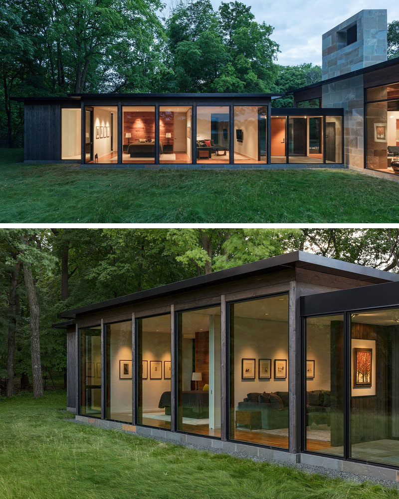 The materials used on the exterior of this modern house is dark-stained cedar wood and glass with a stone base and fireplace of bluestone. #Architecture #BuildingMaterials #HouseDesign