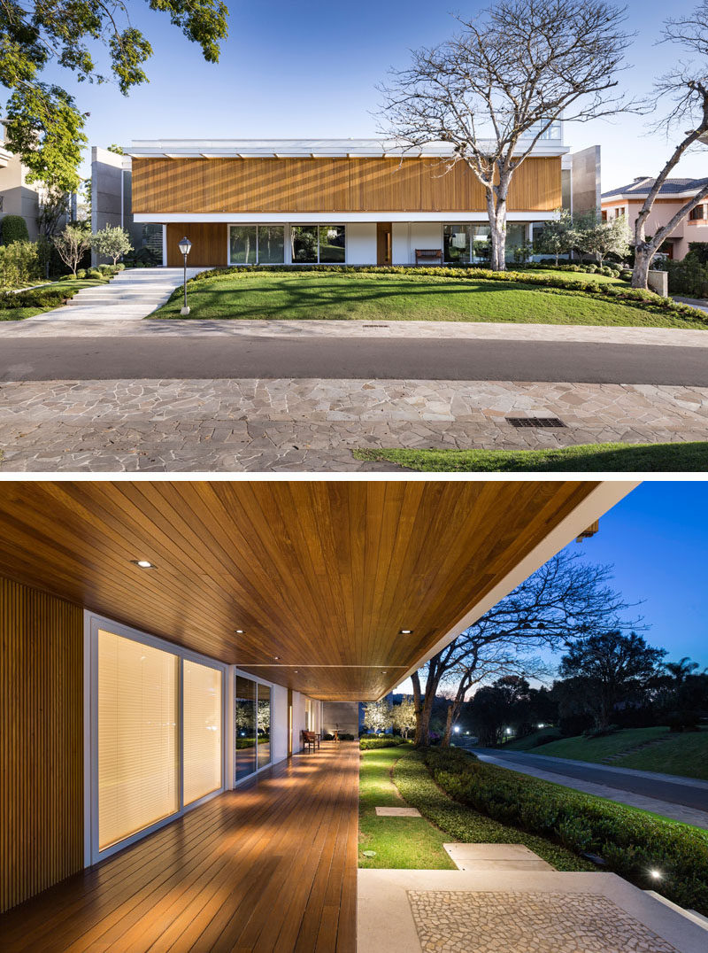 The design of this modern house uses two large concrete walls on the sides to block the neighbors’ views to the house, granting privacy for the home owners,while an overhang creates a place to sit outside and street view. #ModernHouse #Architecture